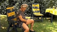 Horny old granny gobbles up his dick and gets drilled outside